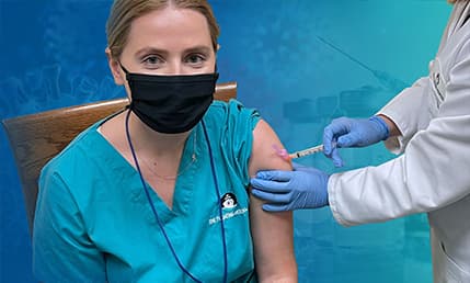 staff member receiving vaccine